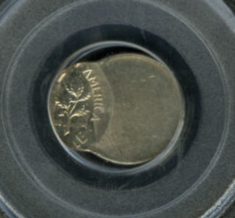 1961 Roosevelt dime off-center strike error showing blank planchet visible and date retained